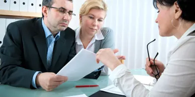 Picture of people reviewing a document